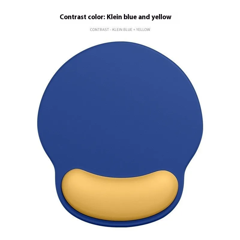 Silicone mouse mat with wrist support in a gradient blue colour on a desk.