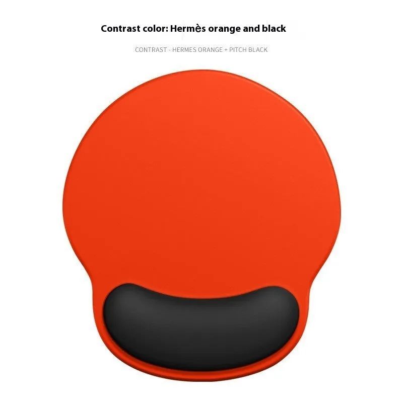 Silicone mouse mat with wrist support in a gradient blue colour on a desk.