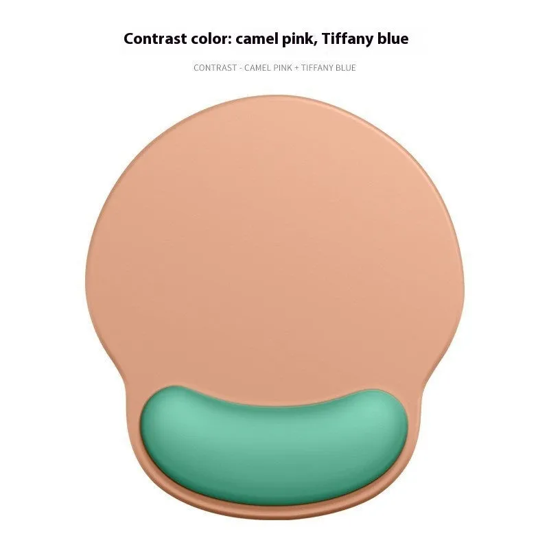 Silicone mouse mat with wrist support in a gradient blue colour on a desk.