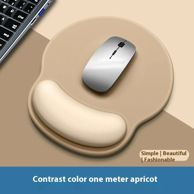 Silicone mouse mat with wrist support in a gradient blue colour on a desk.