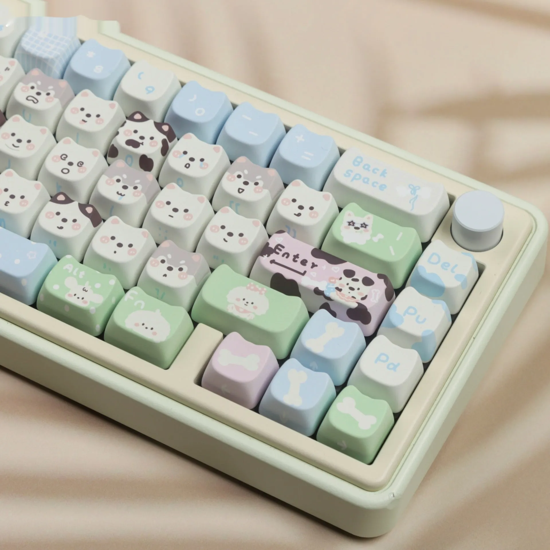Full set of colourful PBT keyboard keycaps with sublimated cute puppy and cat designs laid out.