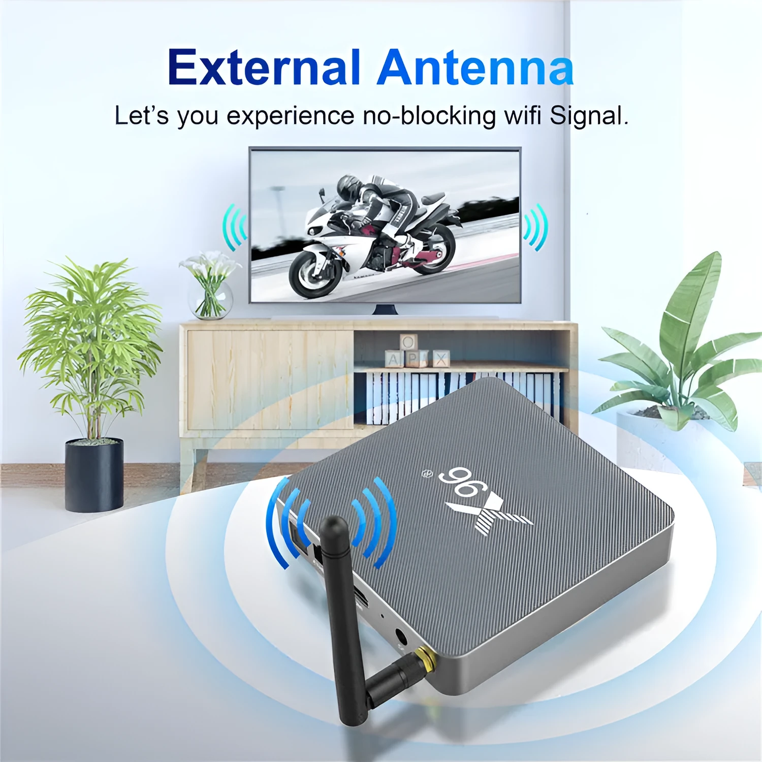 Android smart TV set-top box with voice remote control on a wooden table next to a television.