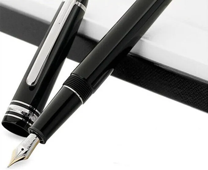 Black fountain pen with gold clip and two-colour nib, 0.7mm iridium tip, on a desk
