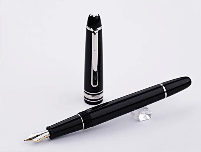 Black fountain pen with gold clip and two-colour nib, 0.7mm iridium tip, on a desk