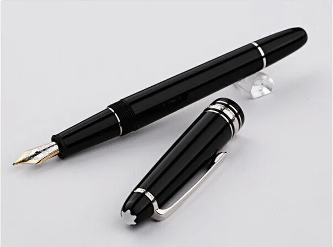 Black fountain pen with gold clip and two-colour nib, 0.7mm iridium tip, on a desk