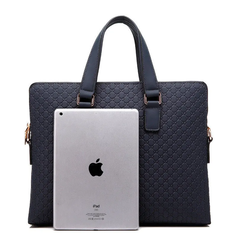 Genuine leather men's business handbag in blue with embossed geometric pattern, soft handles, and zipper closure, designed for a 14-inch laptop