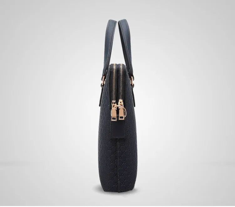 Genuine leather men's business handbag in blue with embossed geometric pattern, soft handles, and zipper closure, designed for a 14-inch laptop