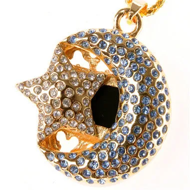 Creative jewellery-inspired metal USB flash drive on a plain background.