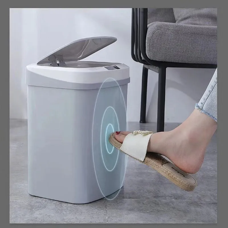 Smart induction trash can in black plastic with lid open, for kitchen or bathroom