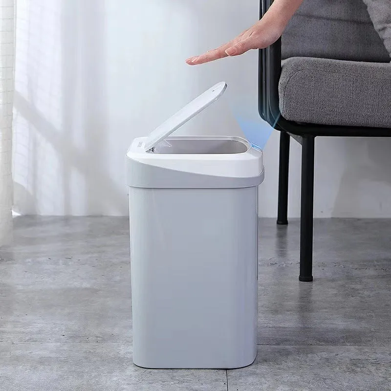Smart induction trash can in black plastic with lid open, for kitchen or bathroom