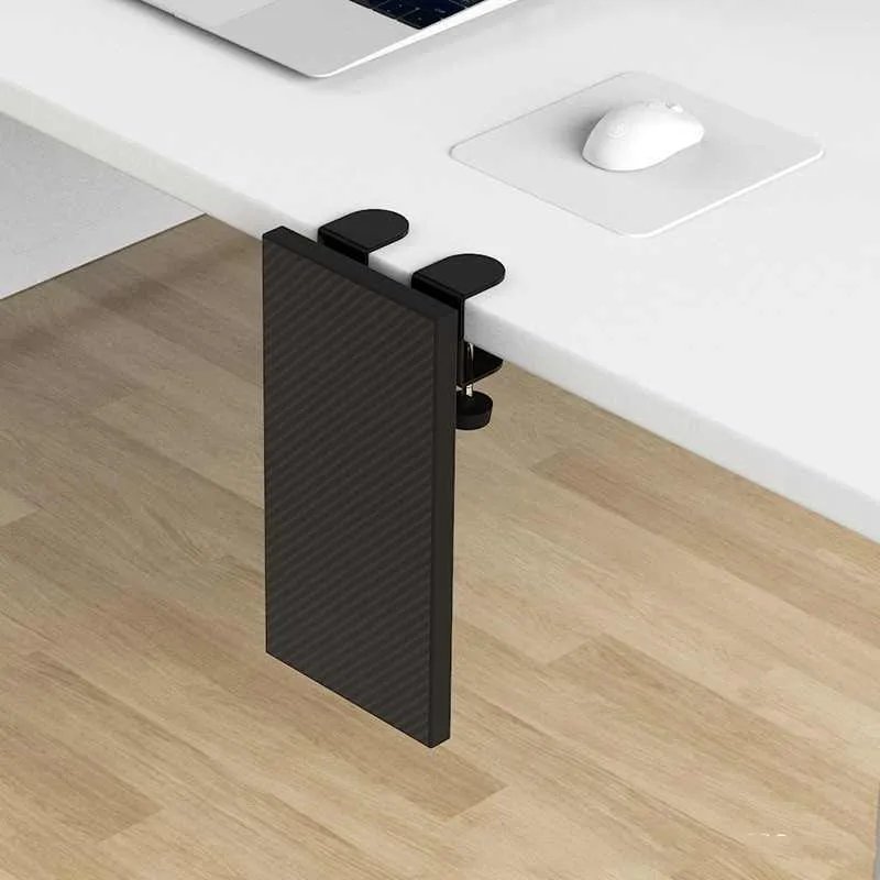 Ergonomic hand bracket in black carbon fiber veneer on a desk for arm support during computer use