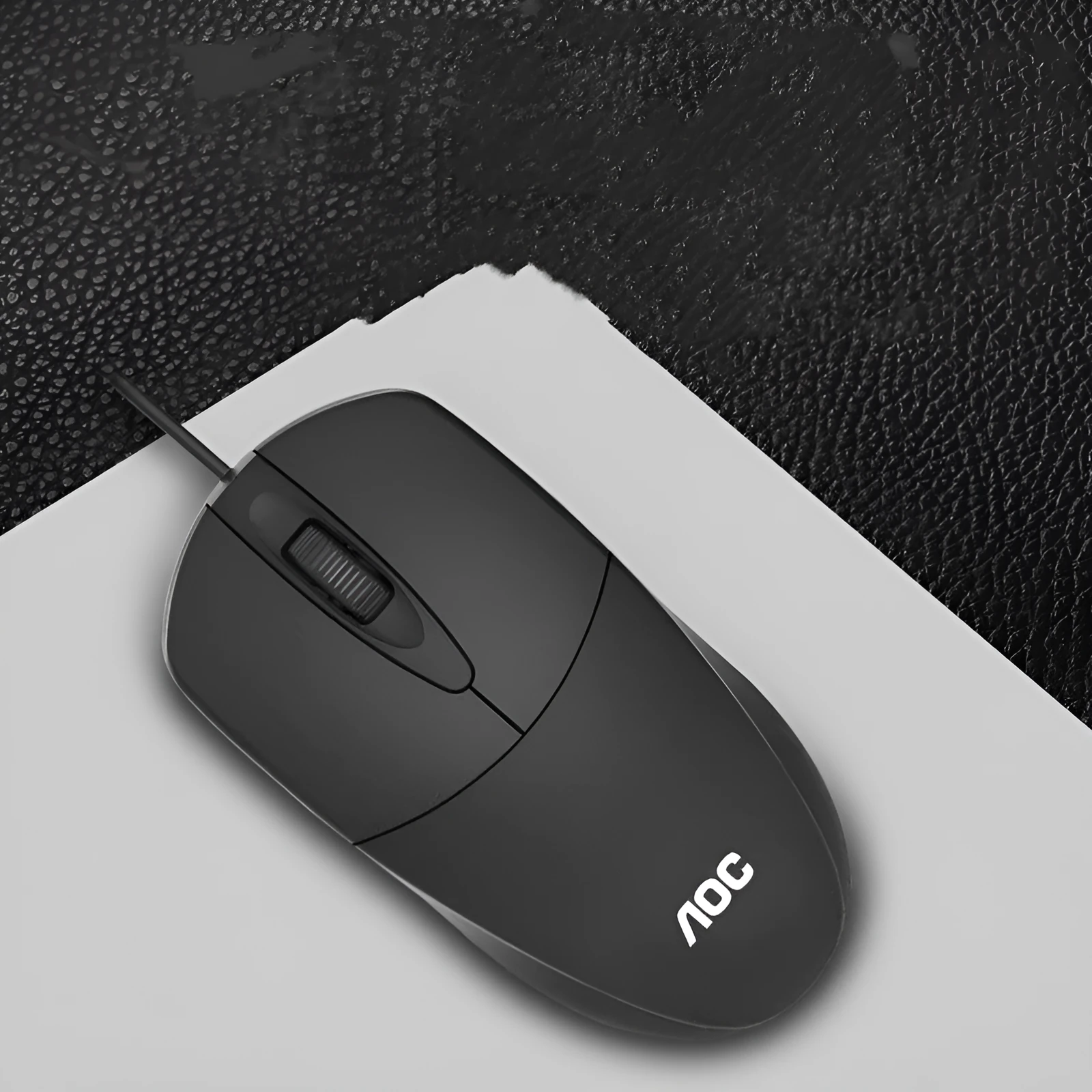 Black AOC-MS121 wired USB optical mouse on a desk for office use