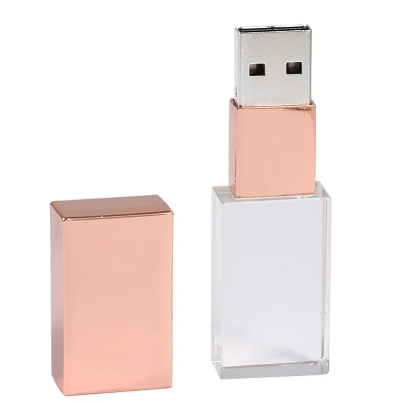 Transparent glass USB flash drive with stainless steel frame in gold colour showing USB connector