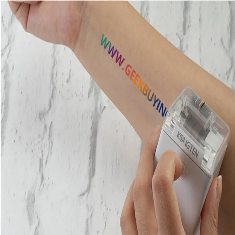 Portable Mbrush color handheld printer in white with ink cartridges showing compact size