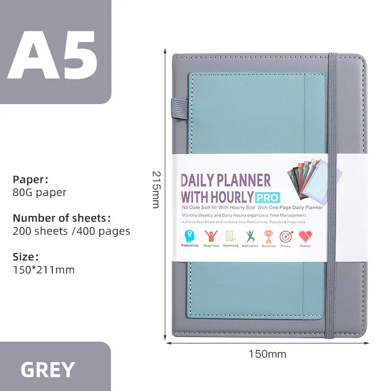A5 notebook with PU leather cover in various colours, shown open to reveal blank pages and planning stickers.