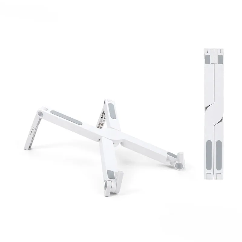 Folding aluminium alloy laptop stand in grey on a wooden desk, showing adjustable width and non-slip pads