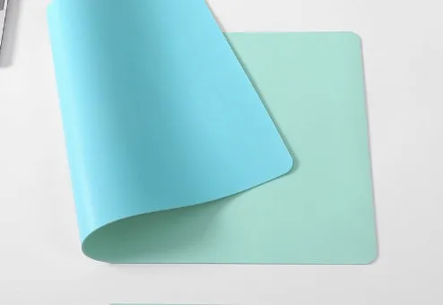 Oversized rubber mouse pad 30x60cm in black with stitched edges for PC laptop use.