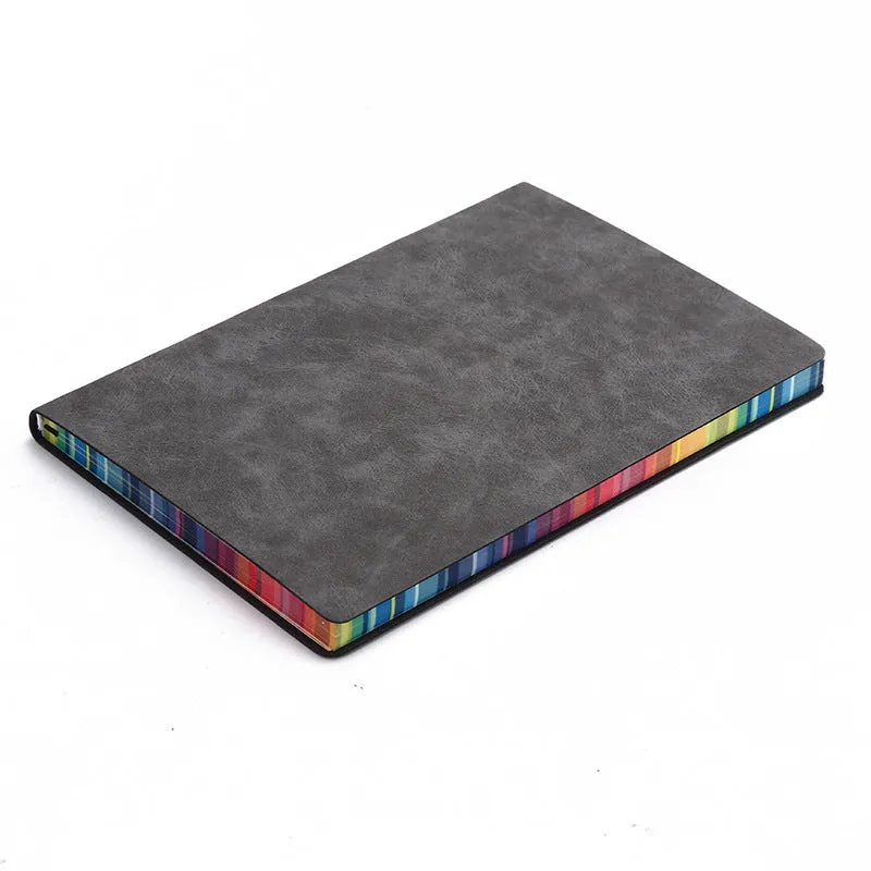 A5 rainbow side PU leather cover notebook open on a desk, showing lock line hardcover binding and 100g Daolin paper pages