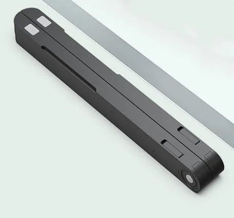 Black ABS folding laptop stand on desk with laptop placed on top