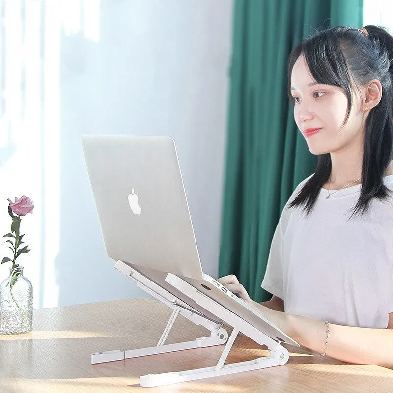 Black ABS folding laptop stand on desk with laptop placed on top