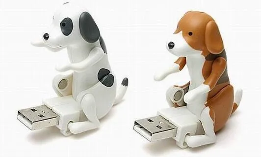 USB dancing dog toy in random colour made from ABS plastic on a desk