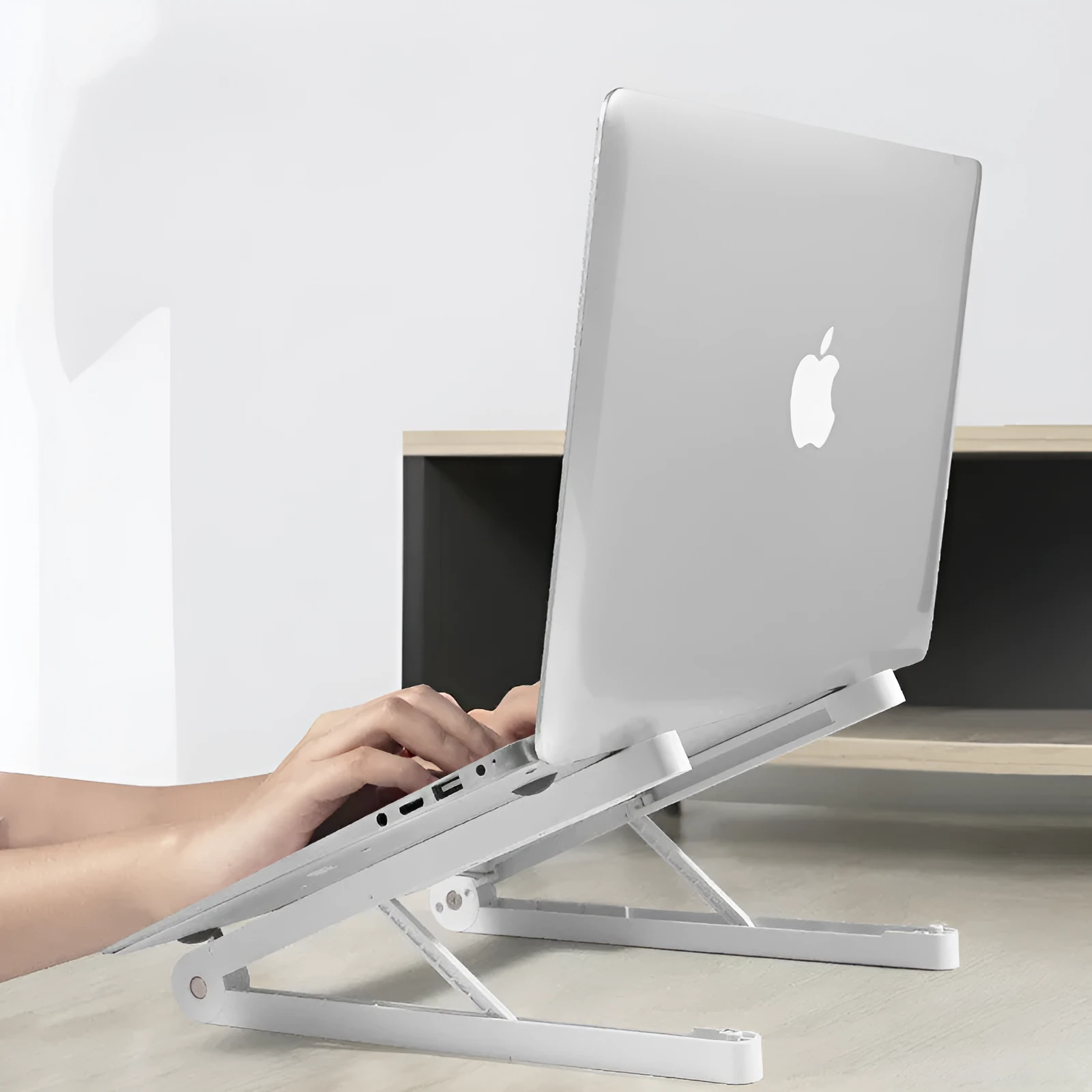 ABS folding notebook stand in black, 32x275mm, with laptop on top