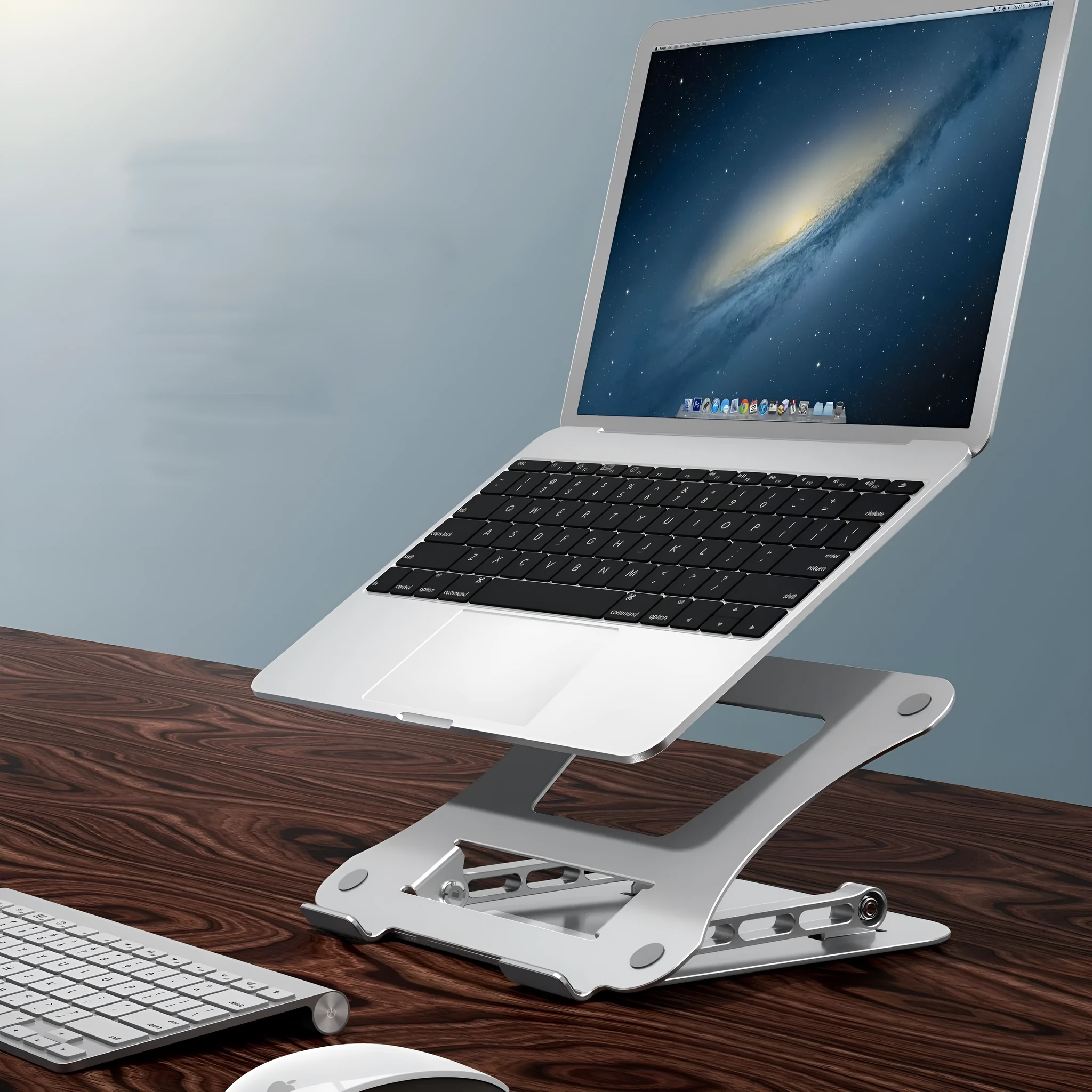 Silver aluminium alloy folding laptop cooling stand on a desk with a notebook placed on it