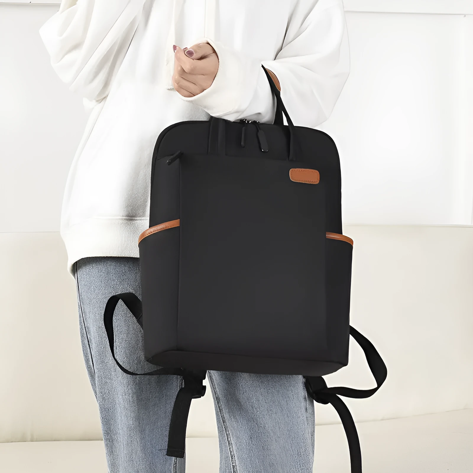 15.6-inch canvas computer backpack in black with waterproof finish and multiple internal compartments
