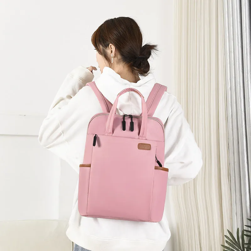 15.6-inch canvas computer backpack in black with waterproof finish and multiple internal compartments