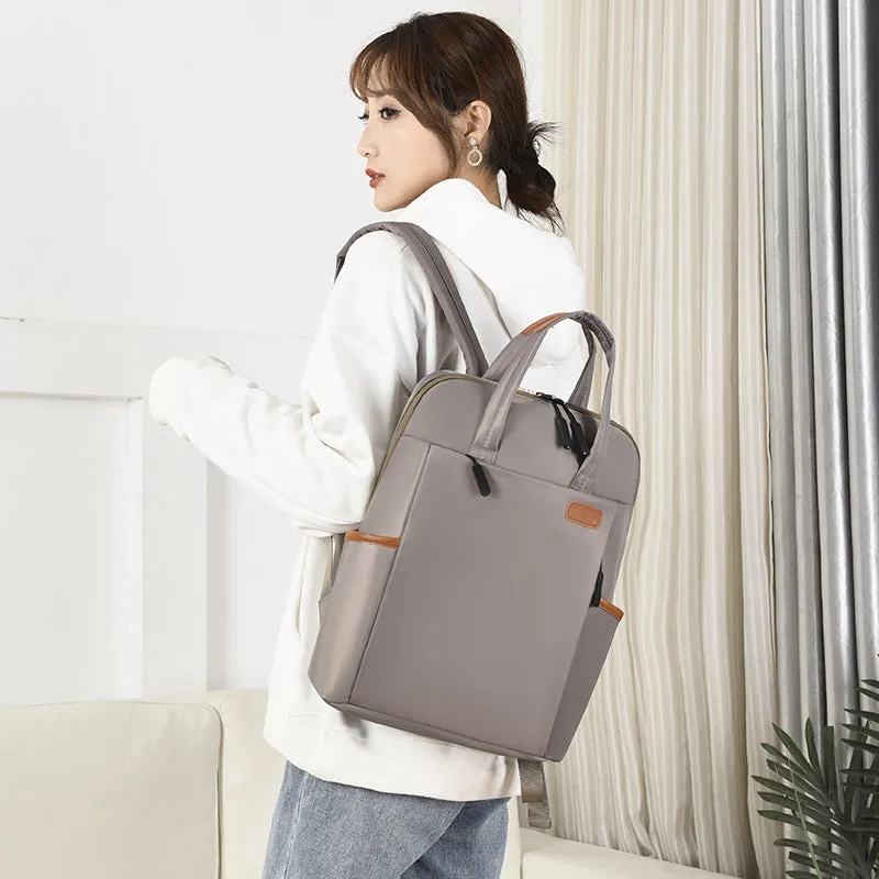 15.6-inch canvas computer backpack in black with waterproof finish and multiple internal compartments