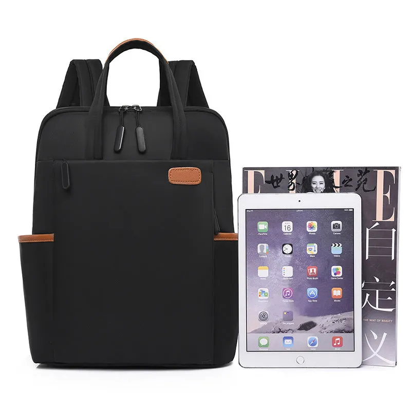 15.6-inch canvas computer backpack in black with waterproof finish and multiple internal compartments