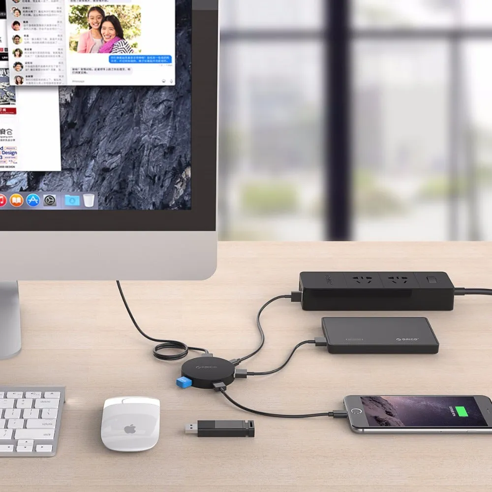 ORICO HA4U-U3 USB 3.0 hub with four ports, compact black plastic casing, 60x60x12mm