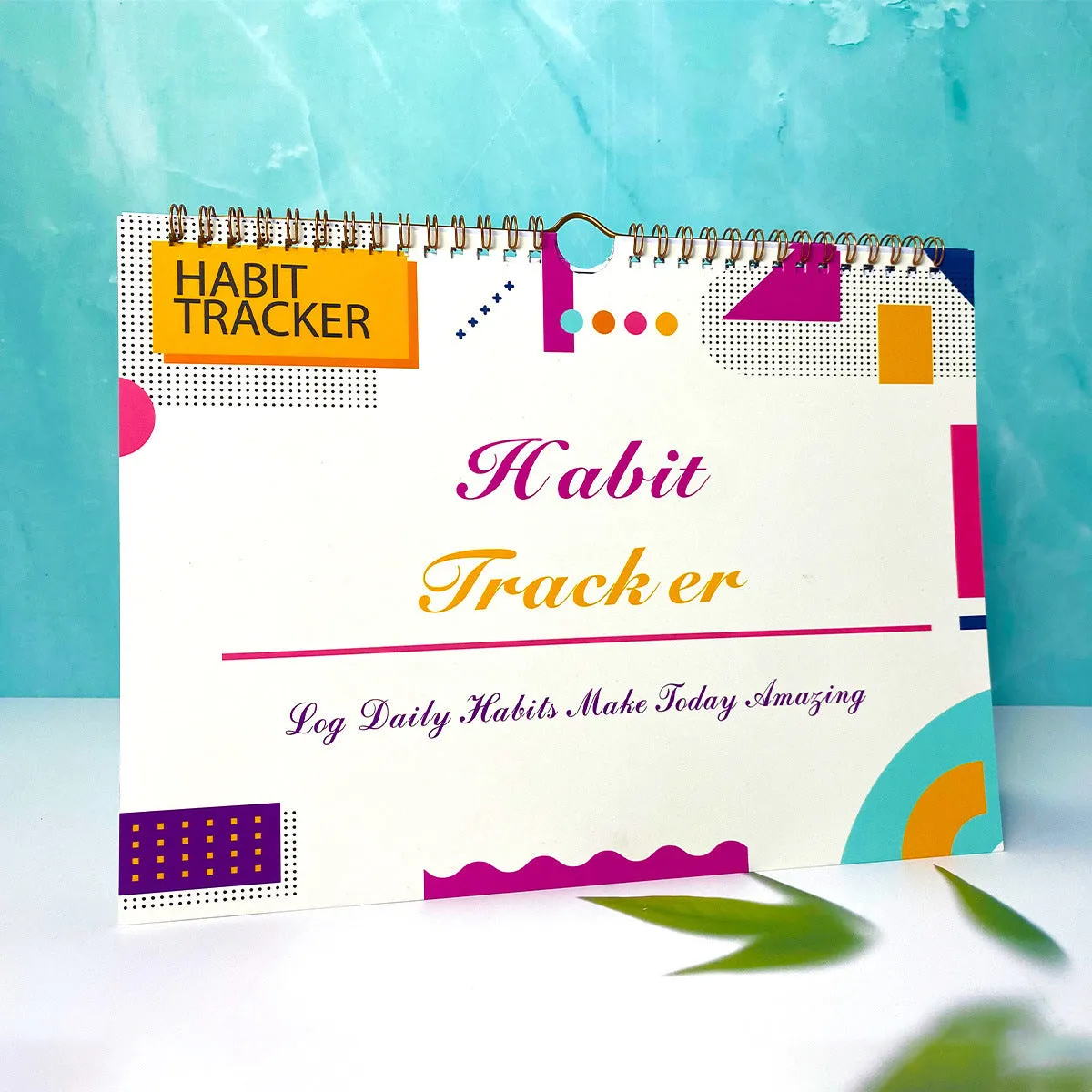 English habit tracking notebook open showing 12 internal pages with A4 21x28cm dimensions