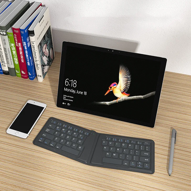 Aerospace folding Bluetooth keyboard with 64 keys and USB charging cable