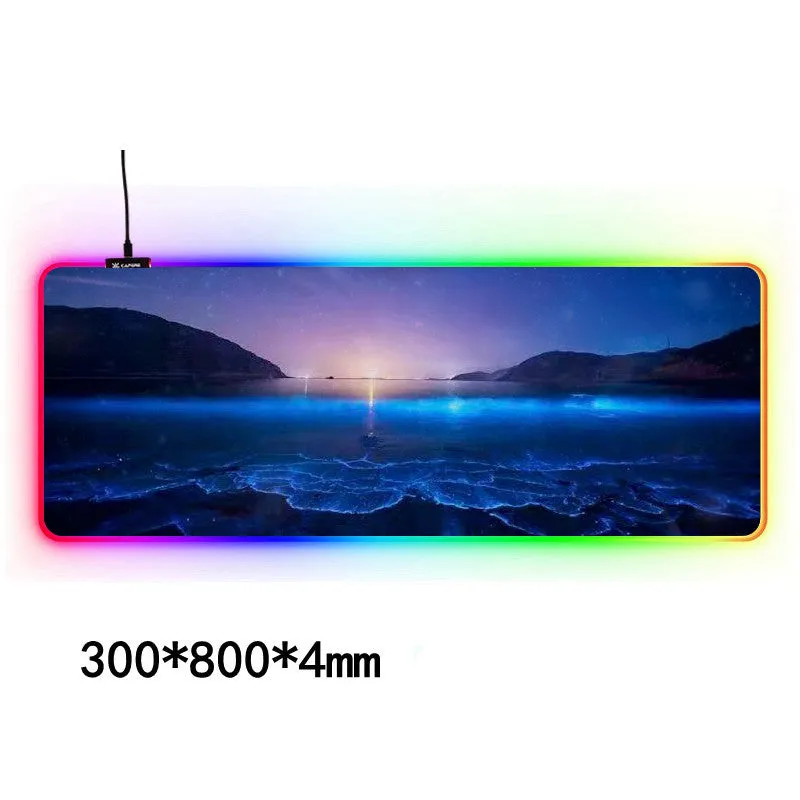 Large RGB gaming mouse pad with waterproof cloth surface and colourful stitched edge, featuring seven style options
