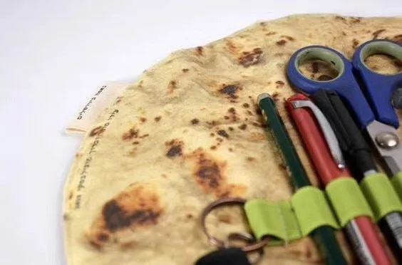 Novelty fabric pencil holder shaped like a burrito roll, 22cm square, in shown colour