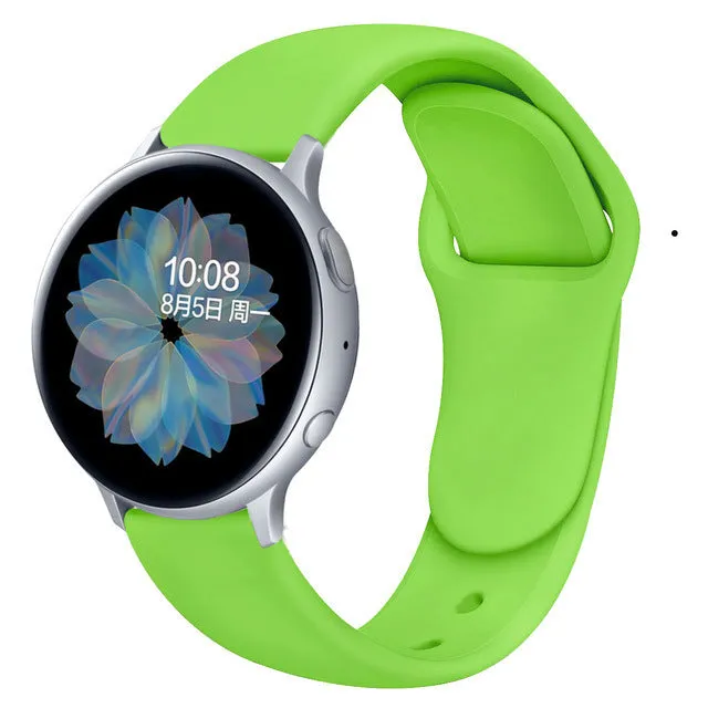 Samsung Galaxy Active 2 smartwatch with a purple silicone replacement strap featuring a reverse buckle clasp.