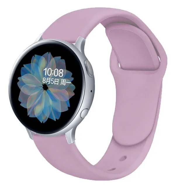 Samsung Galaxy Active 2 smartwatch with a purple silicone replacement strap featuring a reverse buckle clasp.