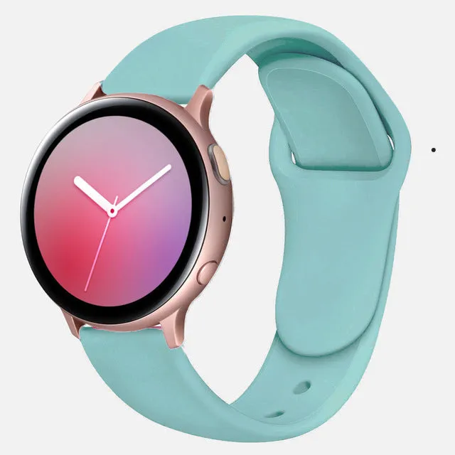 Samsung Galaxy Active 2 smartwatch with a purple silicone replacement strap featuring a reverse buckle clasp.