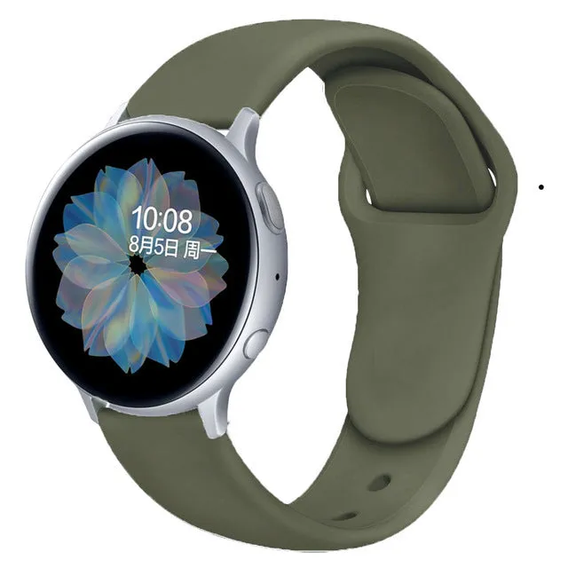 Samsung Galaxy Active 2 smartwatch with a purple silicone replacement strap featuring a reverse buckle clasp.