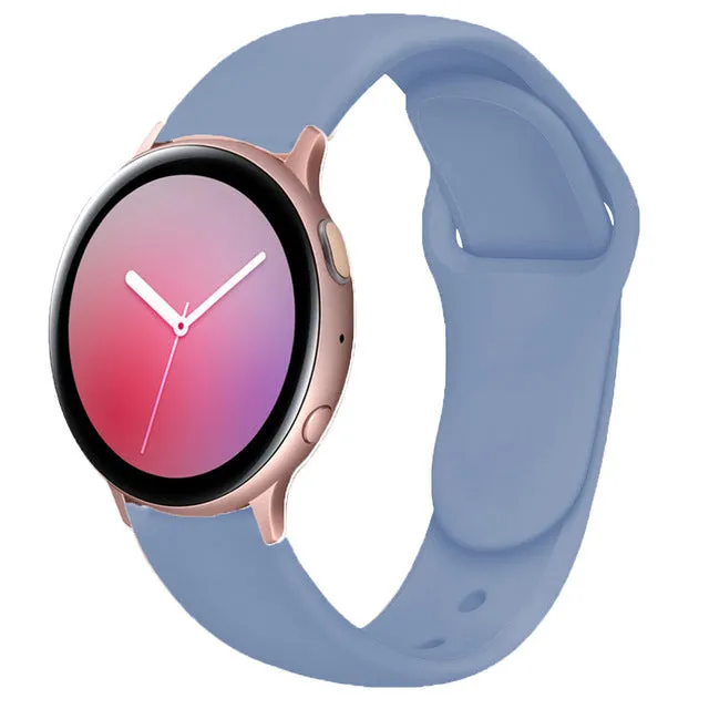 Samsung Galaxy Active 2 smartwatch with a purple silicone replacement strap featuring a reverse buckle clasp.