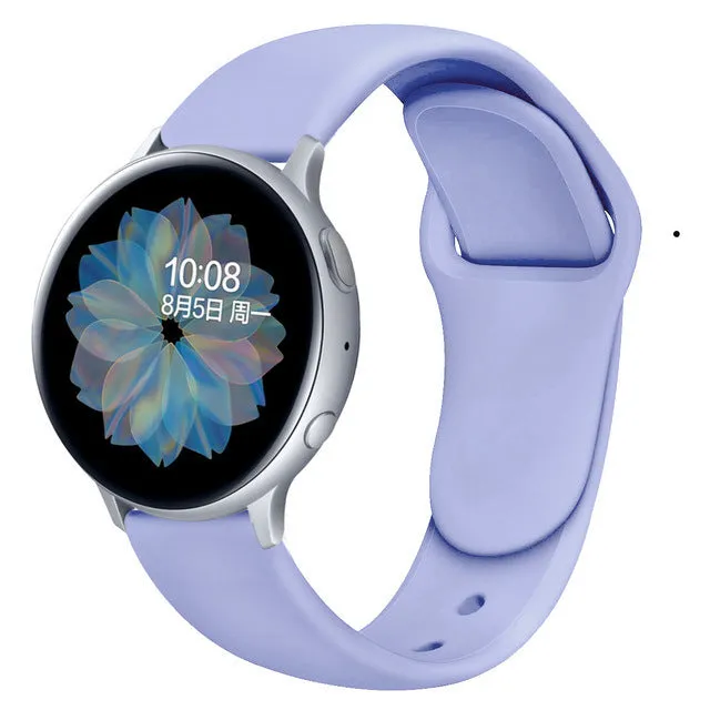 Samsung Galaxy Active 2 smartwatch with a purple silicone replacement strap featuring a reverse buckle clasp.