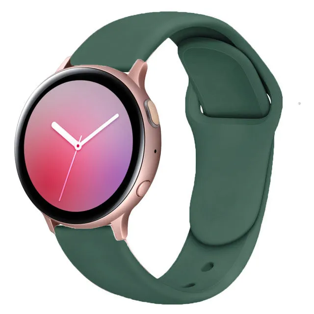 Samsung Galaxy Active 2 smartwatch with a purple silicone replacement strap featuring a reverse buckle clasp.