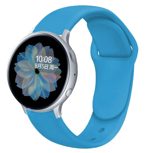 Samsung Galaxy Active 2 smartwatch with a purple silicone replacement strap featuring a reverse buckle clasp.