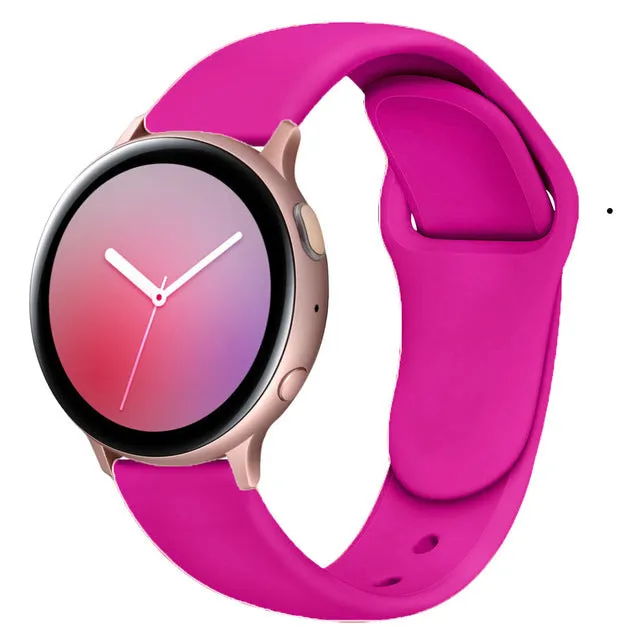 Samsung Galaxy Active 2 smartwatch with a purple silicone replacement strap featuring a reverse buckle clasp.