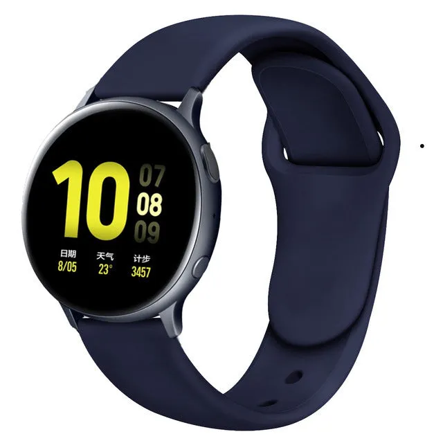 Samsung Galaxy Active 2 smartwatch with a purple silicone replacement strap featuring a reverse buckle clasp.