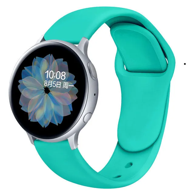 Samsung Galaxy Active 2 smartwatch with a purple silicone replacement strap featuring a reverse buckle clasp.