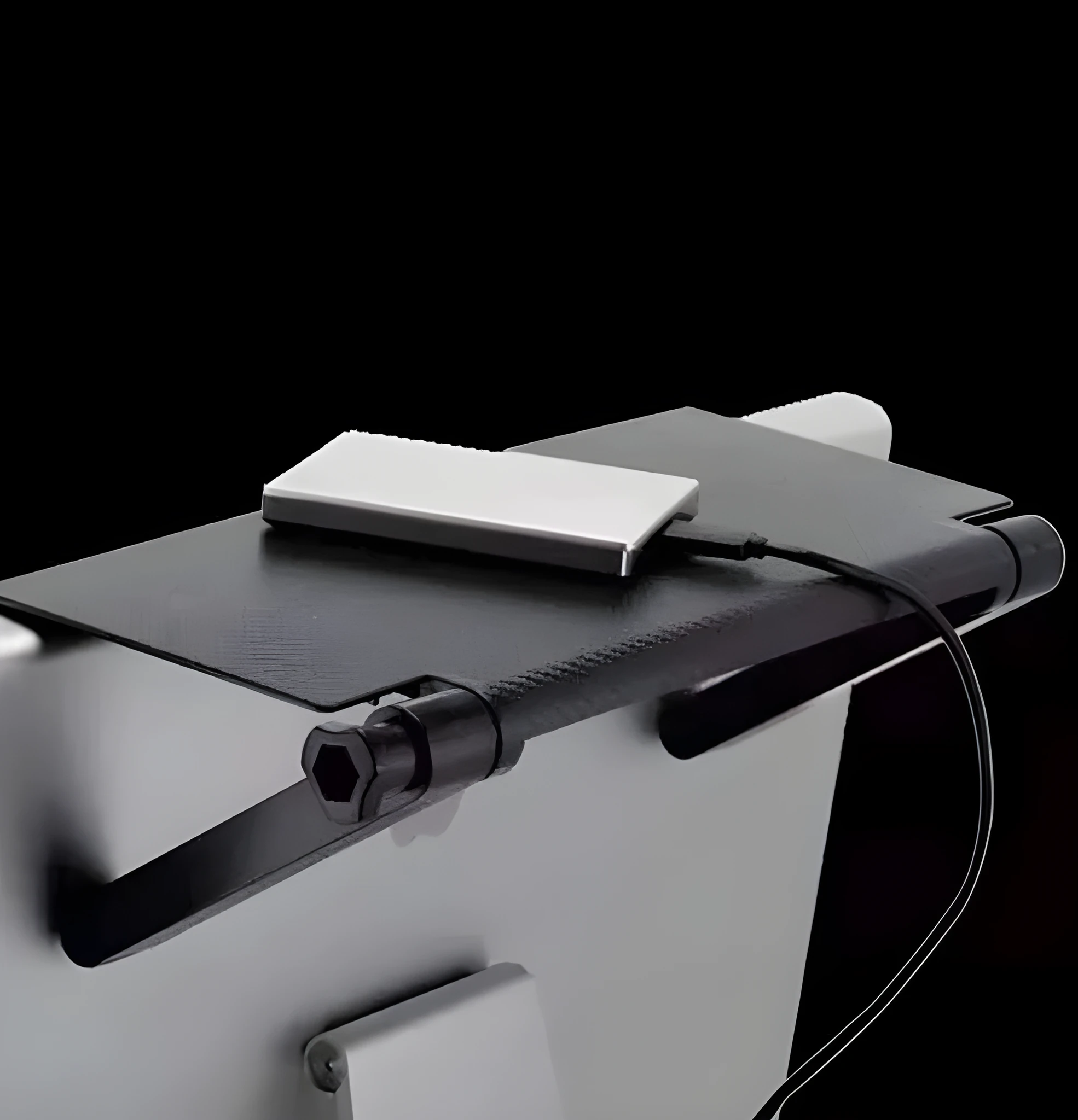 Adjustable black screen top shelf compatible with Apple TV and Roku, 13-inch size, on a computer monitor