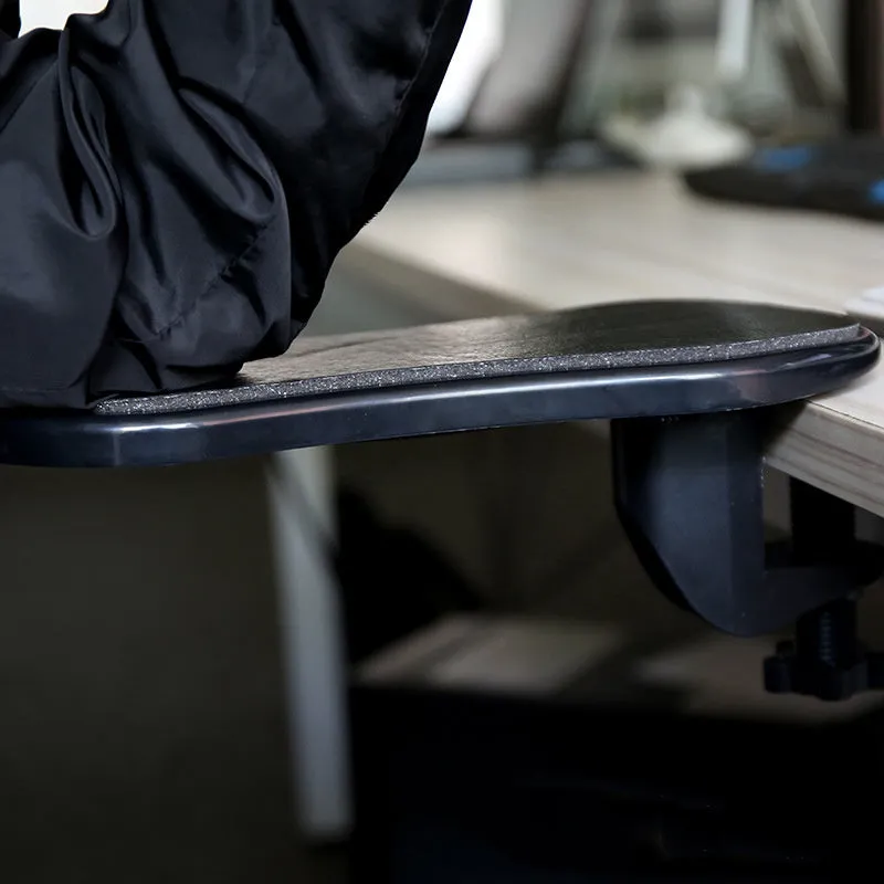 Ergonomic computer hand bracket mouse wrist pad in black leather finish with non-slip rubber base on a desk