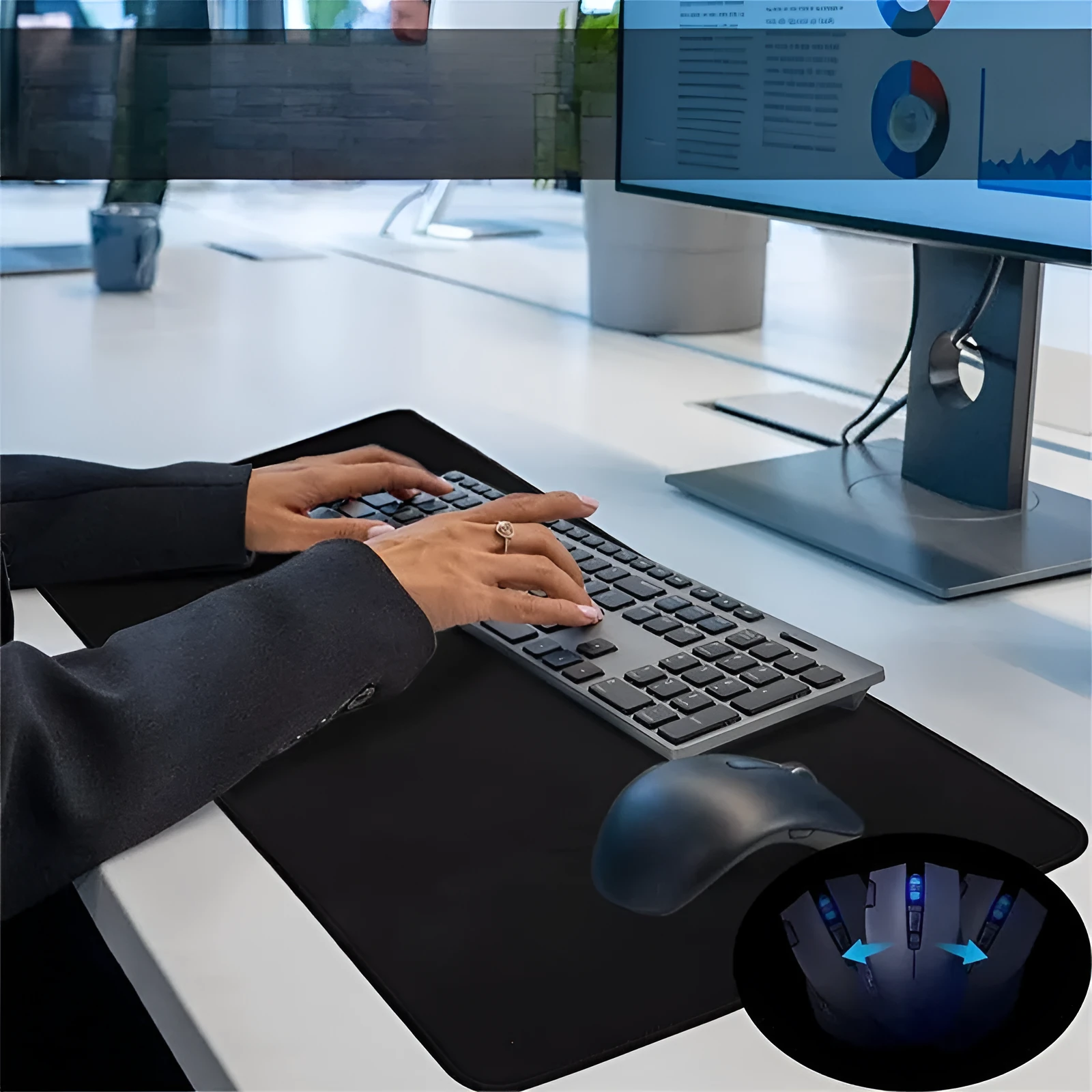 Large black and white gaming mouse pad with non-slip rubber bottom and cloth cover on a desk